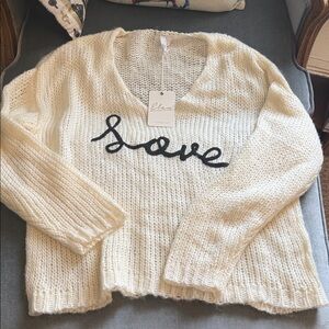 Elan Cream V-Neck Sweater with Black Script